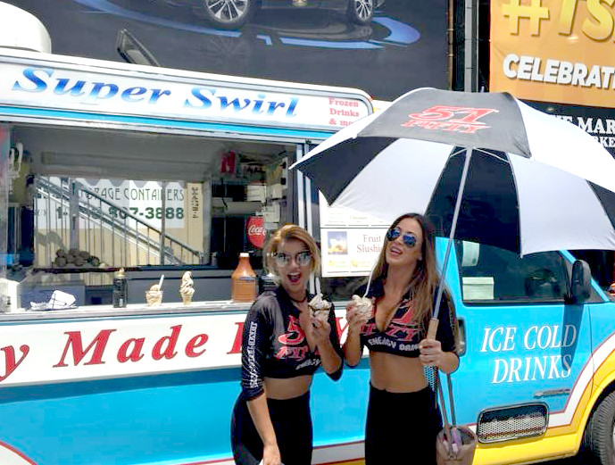 Super Swirl ice cream truck at a concert or large outdoor event